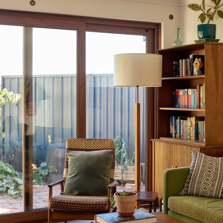 After: the new Turner Oak Walnut uPVC double glazed sliding door, with slim frames, clear views to the garden and no security grille