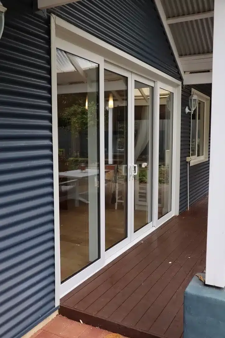 Premier uPVC vario slide doors opening to a garden and pool